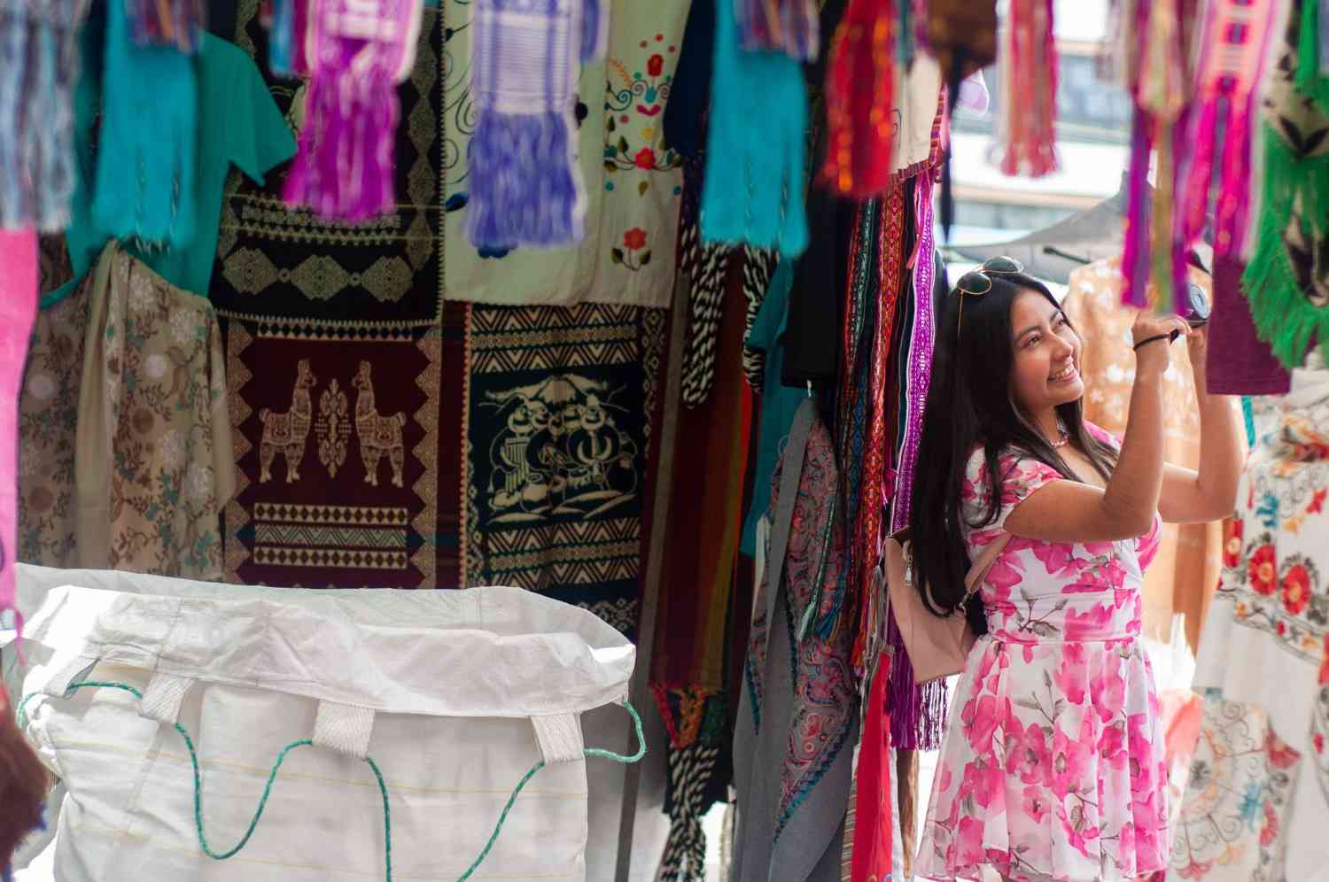 Woman looking through several clothes